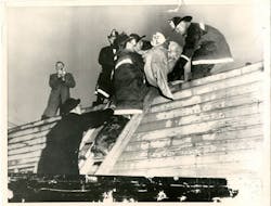 A vintage photo showing one of 18 victims being removed from the scene of the Moonglow Hotel fire in Niagara Falls, NY, in November 1957. A vintage photo showing one of 18 victims being removed from the scene of the Moonglow Hotel fire in Niagara Falls, NY, in November 1957.