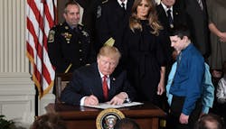 President Donald Trump signs a presidential memorandum to declare the nation&apos;s opioid crises a public health emergency during an event in the East Room of the White House on Oct. 26, 2017, in Washington, D.C.