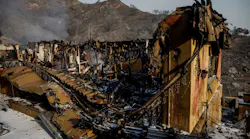 Heat and smoke rise from the rubble of a home destroyed by the Thomas Fire on Sunday, Dec. 17, 2017 in Montecito, CA.