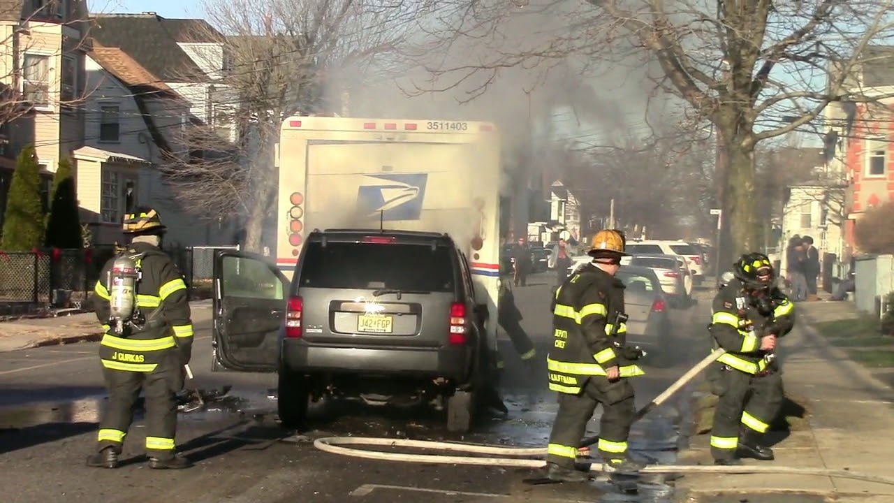NJ Firefighters Douse Blaze after Mail Truck Collision