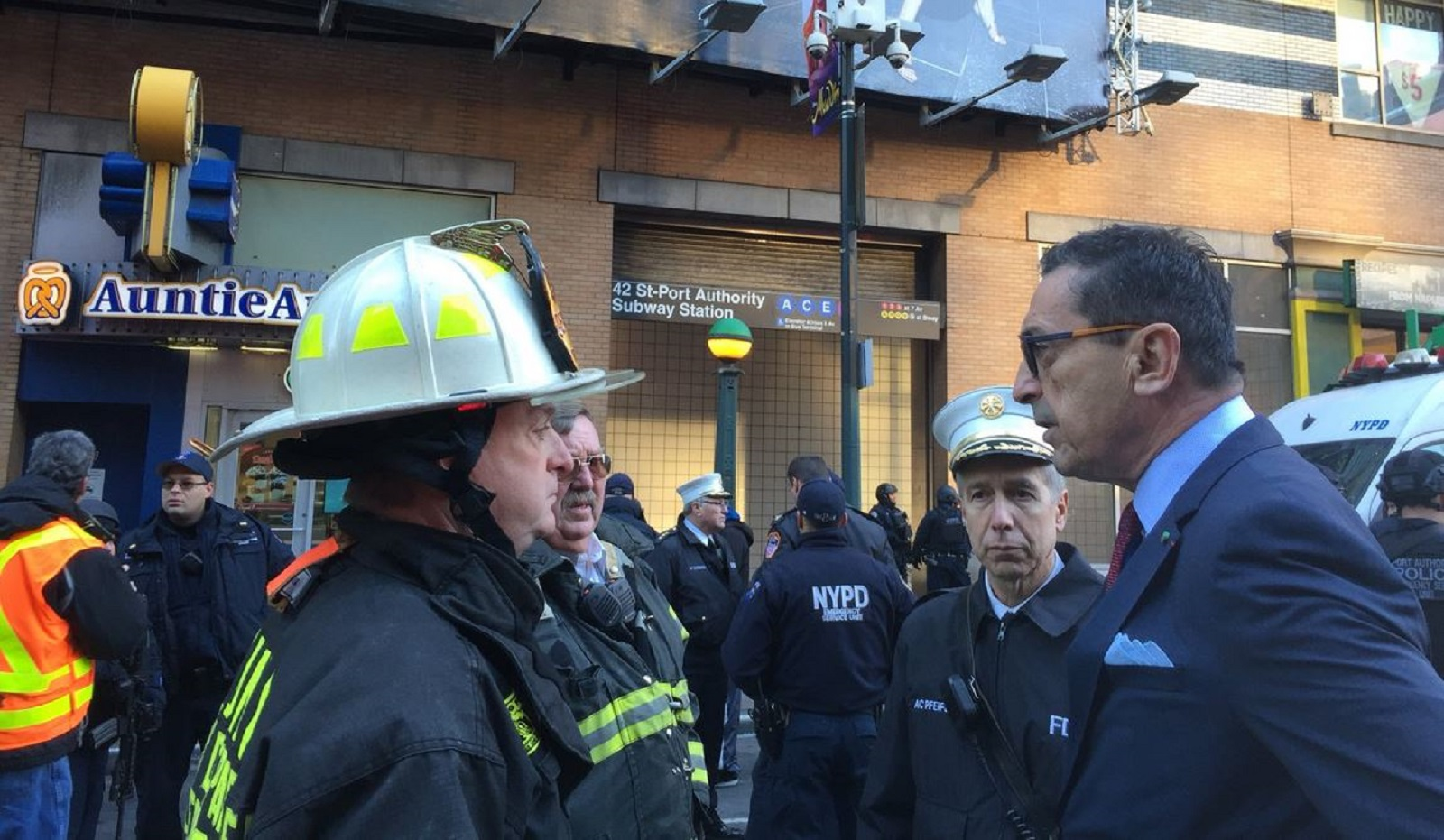 New York City Fire Commissioner Daniel Nigro, right, was among those on the scene Monday morning after a pipe bomb was detonated at the Port Authority bus terminal in midtown Manhattan.