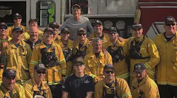 Actor Rob Lowe poses with firefighters battling the Thomas Fire in Ventura and Santa Barbara counties after thanking them with a home-cooked meal.