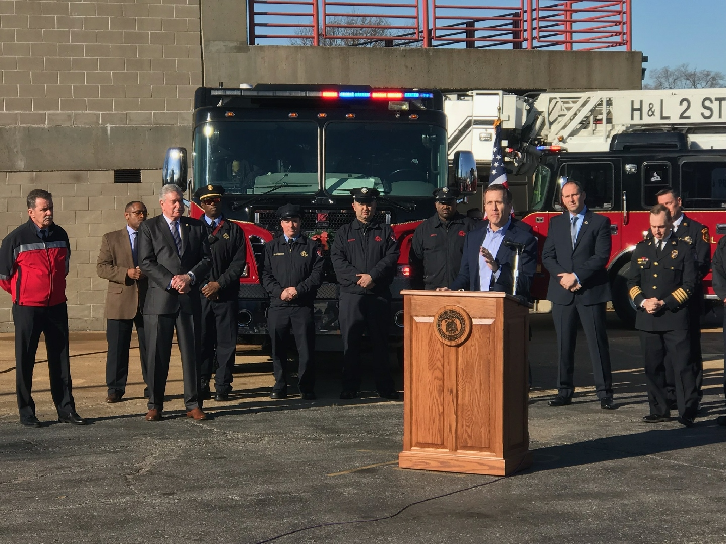 Missouri Gov. Eric Greitens speaks at a press conference in St. Louis on Wednesday announcing his endorsement of presumptive cancer legislation for firefighters in the state. IAFF President Harold Schaitberger, second from left, was on hand.