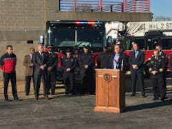 Missouri Gov. Eric Greitens speaks at a press conference in St. Louis on Wednesday announcing his endorsement of presumptive cancer legislation for firefighters in the state. IAFF President Harold Schaitberger, second from left, was on hand.