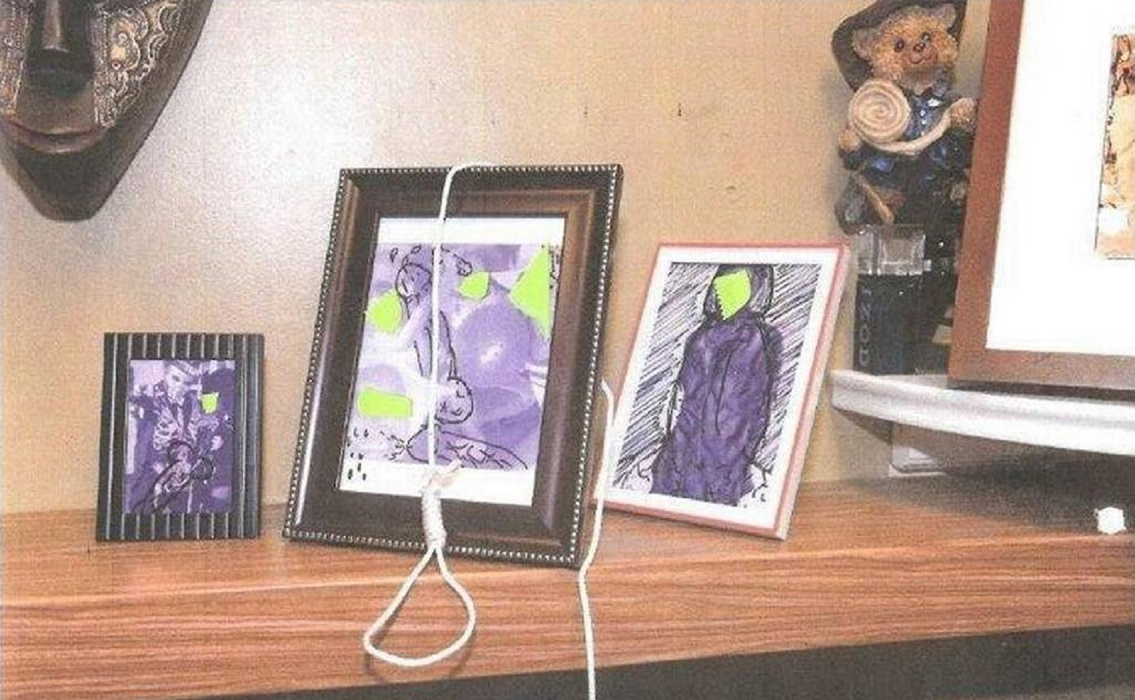 This image released by Miami Fire Rescue shows the lewd images and the noose that were left on a black firefighter's family photos and led to the firing of six firefighters.