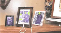 This image released by Miami Fire Rescue shows the lewd images and the noose that were left on a black firefighter's family photos and led to the firing of six firefighters.