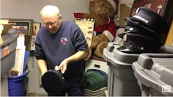 Retired Worcester Fire Lt. Donald Courtney looks at some of the uniform hats that were left in Worcester following the Worcester Cold Storage fire. Retired Worcester Fire Lt. Donald Courtney looks at some of the uniform hats that were left in Worcester following the Worcester Cold Storage fire.