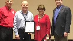 Corey D. Lane (second from left) received the 2017 EVT of the Year Award from FDSOA Executive Director Rich Marinucci (left to right), Firehouse Special Projects Director Janet Wilmoth and Spartan Motors National Sales Manager Brian Connely.