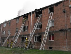 Crews did a good job with ground ladder placement at this fire in a three-story, ordinary construction apartment complex. First- and second-arriving ladder companies must carry a good assortment of straight, roof and extension ladders.