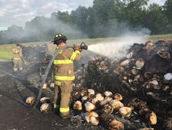 Carthage,MO, firefighters douse a blaze that engulfed a tractor-trailer hauling poultry in May 2015.