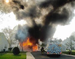 Photo 8: Crews responded to a reported vehicle fire, but it was was in a residential carport with multiple vehicles inside, plus storage. Tactics were changed to structural fire considerations instead of just a vehicle fire. Photo 8: Crews responded to a reported vehicle fire, but it was was in a residential carport with multiple vehicles inside, plus storage. Tactics were changed to structural fire considerations instead of just a vehicle fire.