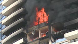 Fire rages on an upper floor of the Marco Polo residential high-rise in Honolulu on July 14, 2017. Fire rages on an upper floor of the Marco Polo residential high-rise in Honolulu on July 14, 2017.