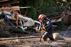 Crews from Orange County Search and Rescue work to locate victims along Olive Mill Road at Hot Springs Road in Montecito, CA, on Wednesday, Jan. 10, 2018.