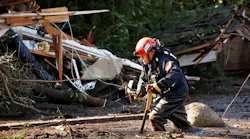 Crews from Orange County Search and Rescue work to locate victims along Olive Mill Road at Hot Springs Road in Montecito, CA, on Wednesday, Jan. 10, 2018.