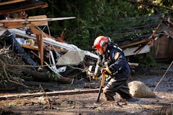 Crews from Orange County Search and Rescue work to locate victims along Olive Mill Road at Hot Springs Road in Montecito, CA, on Wednesday, Jan. 10, 2018.