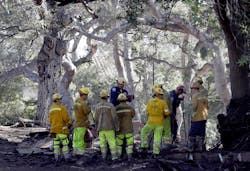 Firefighters prepare to search for the missing after a mudslide along Hot Springs Road in Montecito, CA, on Saturday, Jan. 13, 2018.