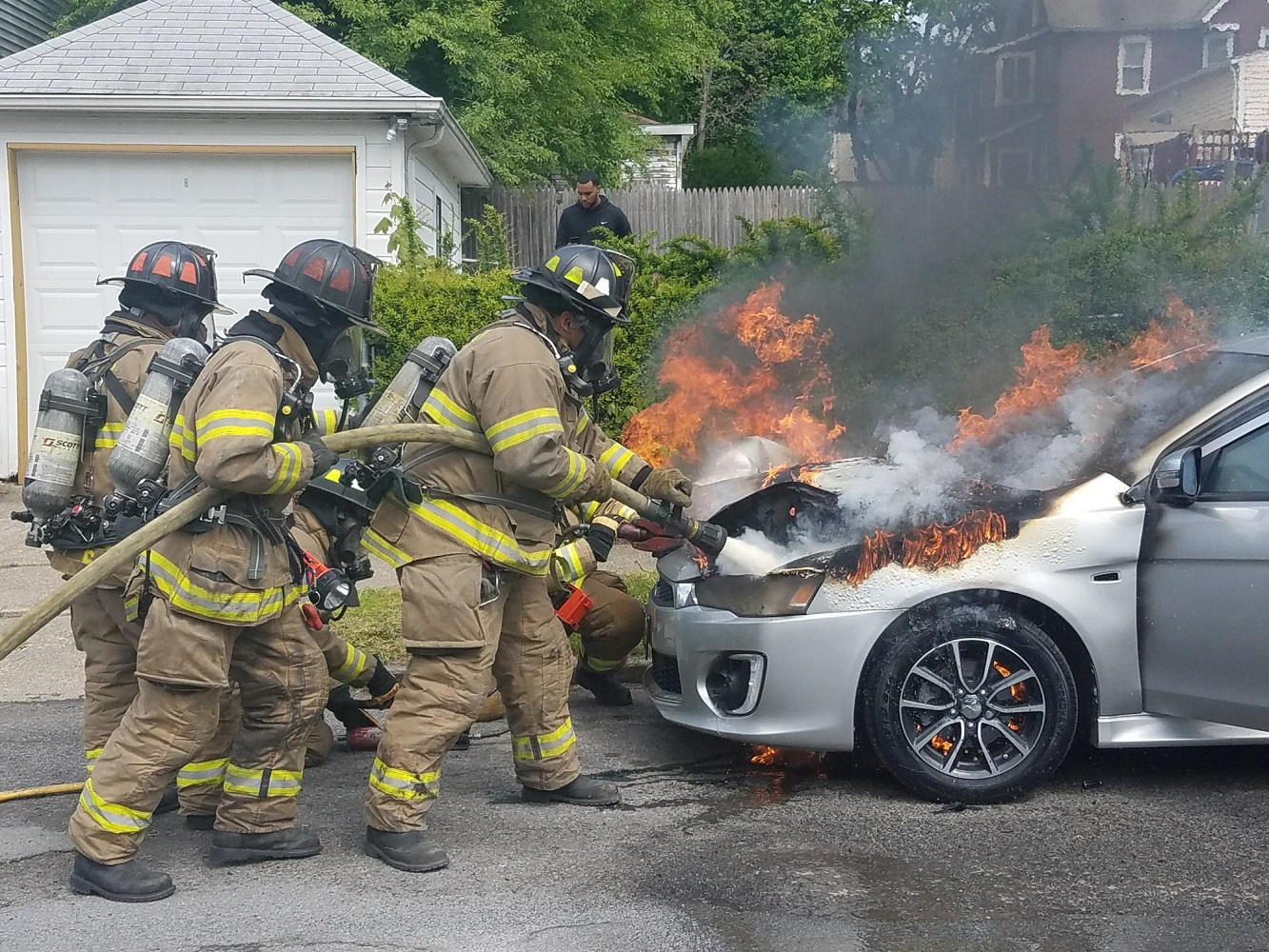 Newburgh, NY, firefighters douse a vehicle fire in May 2017.