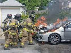 Newburgh, NY, firefighters douse a vehicle fire in May 2017. Newburgh, NY, firefighters douse a vehicle fire in May 2017.