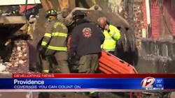 Providence firefighters enter the rubble of a burned down home after a body was discovered on Saturday, Jan. 6, 2018. Providence firefighters enter the rubble of a burned down home after a body was discovered on Saturday, Jan. 6, 2018.