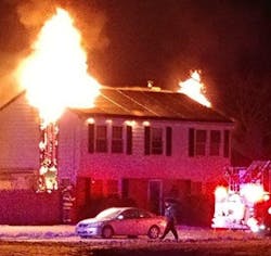 The home of Williamstown, NJ, firefighter Donna Parisi and her family burns on Sunday, Jan. 7, 2018.
