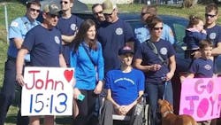 Asheville, NC, firefighter Will Willis, who has terminal kidney cancer, awaits Division Chief Joy Ponder at the finish line of the Black Mountain Marathon on Saturday, Feb. 24, 2018. Asheville, NC, firefighter Will Willis, who has terminal kidney cancer, awaits Division Chief Joy Ponder at the finish line of the Black Mountain Marathon on Saturday, Feb. 24, 2018.