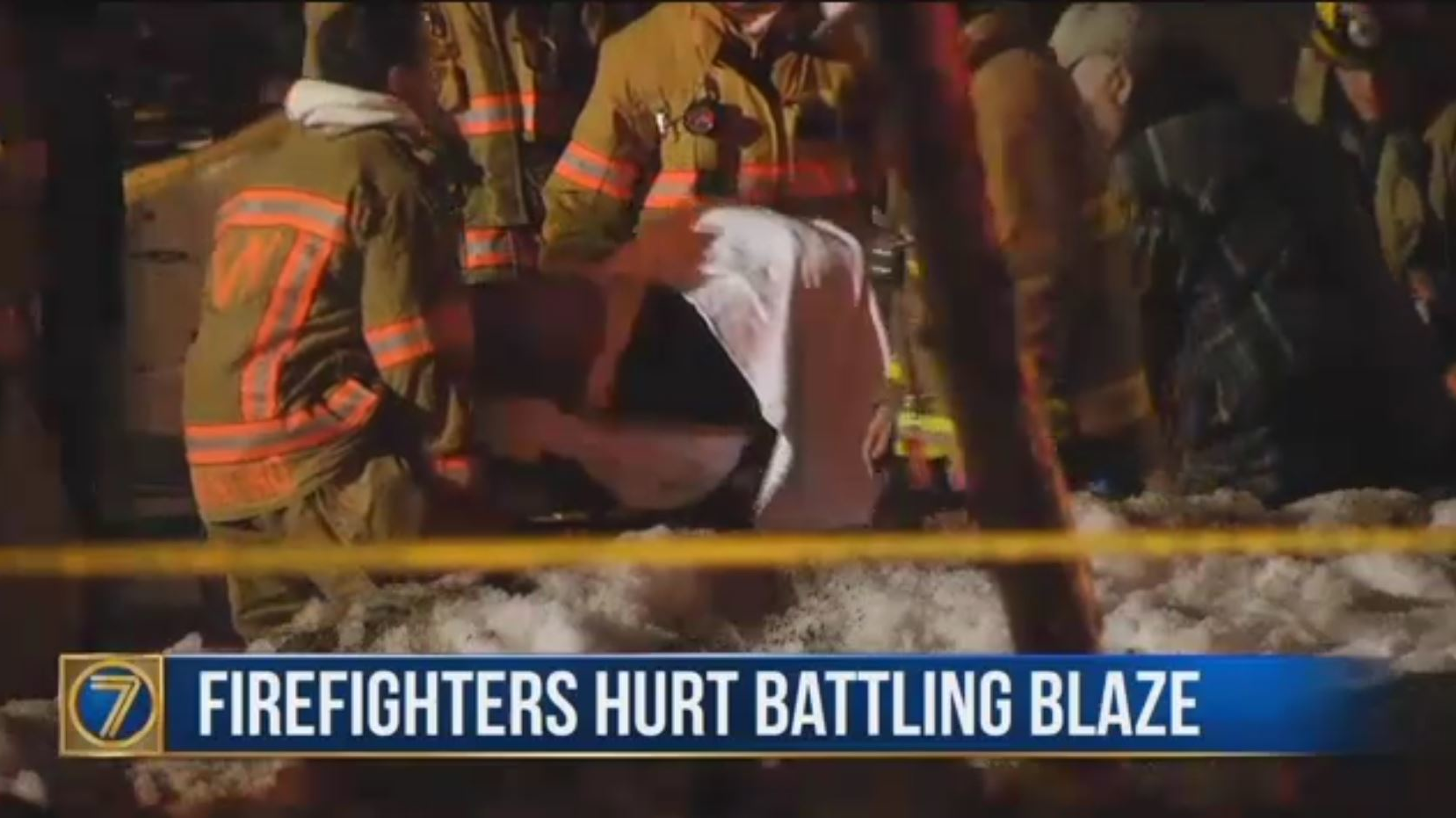 A Watertown, NY, firefighter is removed from the scene on a stretcher after being injured during a fire on Monday, Feb. 19. 2018.