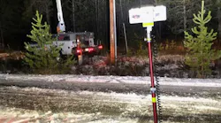 Pole work being safely and completely illuminated from across the road by one LENTRY LIGHT, model 1SPECX.
