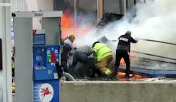 Firefighters from Iron Mountain—the IC, the firefighter on the Blitzforce, the engineer and others—immediately went in with a hoseline and pulled the firefighter to safety. Firefighters from Iron Mountain—the IC, the firefighter on the Blitzforce, the engineer and others—immediately went in with a hoseline and pulled the firefighter to safety.