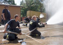 Polish fire instructors &apos;gas cool&apos; as they advance.