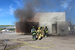 Crews conduct live-fire training in the wired burn building. Crews conduct live-fire training in the wired burn building.