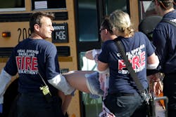 Medical personnel tend to a victim outside of Stoneman Douglas High School in Parkland, Fla., after a shooting on Wednesday, Feb. 14, 2018. Medical personnel tend to a victim outside of Stoneman Douglas High School in Parkland, Fla., after a shooting on Wednesday, Feb. 14, 2018.