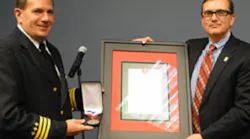 Former Cleveland Battalion Chief and Director of Training Sean DeCrane is presented with the 2013 Excellence in Fire & Life Safety Award from the International Association of Fire Chiefs.