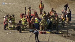 Frisco firefighters are gathered around a construction worker whose leg was mangled by heavy machinery while trauma surgeons prepare to perform an on-scene amputation last week.