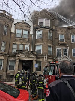 Chicago firefighters on scene at an apartment fire on Wednesday, Feb. 21, 2018, in the Bronzeville neighborhood on the city&apos;s South Side.