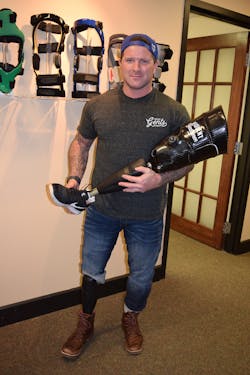 Mike Laughlin holds the Ottobock X3 Microprocessor Prosthetic that both he and Brandon Anderson use. Mike Laughlin holds the Ottobock X3 Microprocessor Prosthetic that both he and Brandon Anderson use.