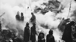 FDNY firefighters stand atop the rubble after a massive blaze at the Elkins Paper Company on Wooster St. in lower Manhattan killed two firefighters and four fire patrol officers on Feb. 14, 1958.