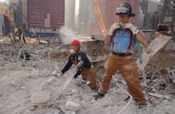 New York Firefighters work at the site of the World Trade Center on Oct. 12, 2001.