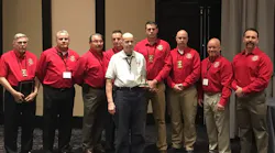 Jack Sullivan (in white) with his 2018 Dave Dodson Lifetime Service Award.