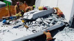 Rescuers search through the rubble of the FIU pedestrian bridge collapse on Thursday, March 15, 2018, at SW 109th Avenue and 8th Street in Miami.