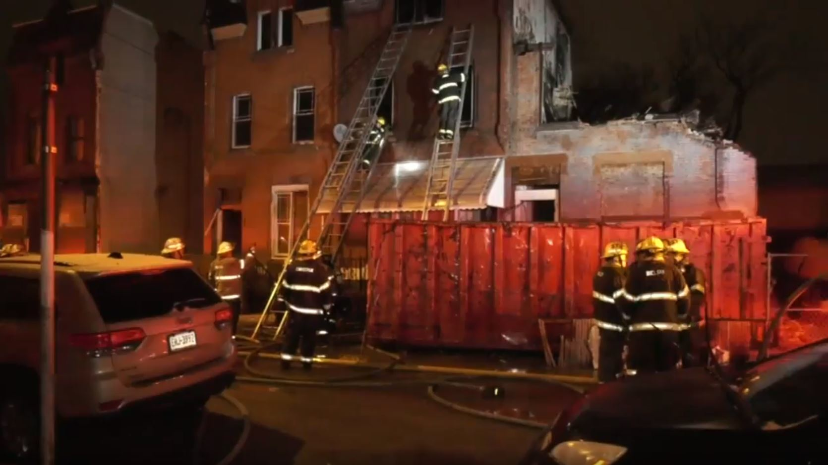 Philadelphia crews on scene during a rowhouse fire early Wednesday that left one man dead and injured two firefighters.