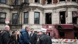 New York City Mayor Bill de Blasio, in blue windbreaker, and FDNY Commissioner Daniel Nigro, wearing tinted glasses, at the scene of a fire in Harlem on March 22, 2018, that killed FDNY Lt. Michael Davidson. New York City Mayor Bill de Blasio, in blue windbreaker, and FDNY Commissioner Daniel Nigro, wearing tinted glasses, at the scene of a fire in Harlem on March 22, 2018, that killed FDNY Lt. Michael Davidson.
