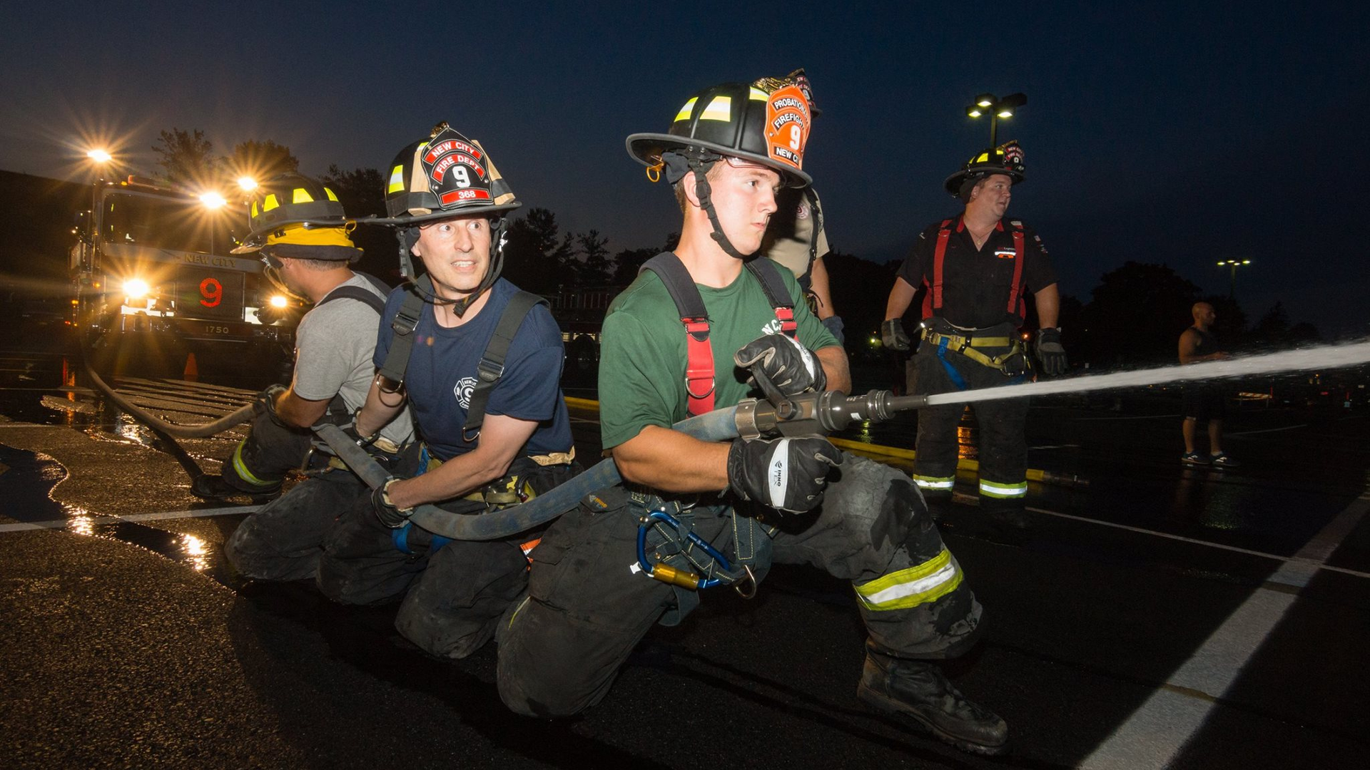 New City, NY, probationary firefighter Will McCue works a hose line during training.