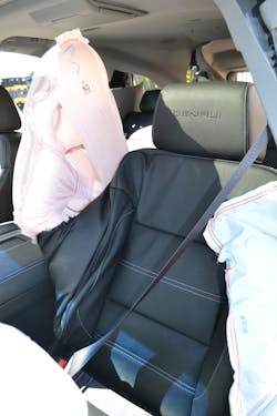 When the GM center-seat airbag deploys, it occupies the area between the driver and front-seat passenger to minimize physical contact during a side collision. The bag will remain firm for several minutes.