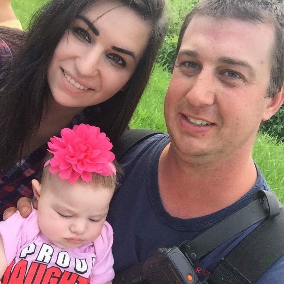 Morrisville, VT, fire Lt. Casey Kuhns with his fiance and newborn daughter in July 2017.