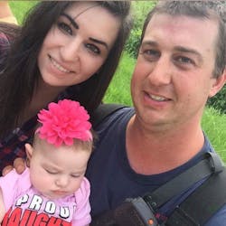 Morrisville, VT, fire Lt. Casey Kuhns with his fiance and newborn daughter in July 2017.