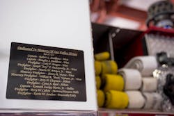 A memorial plaque on a West Volunteer Fire Department engine lists the names of the 10 firefighters and two honorary firefighters who died on April 17, 2013.