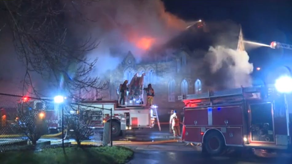 Akron, OH, firefighters battling a blaze at historic St. Paul&apos;s Episcopal Church on Thursday, April 19, 2018.