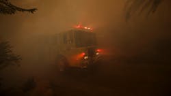 A fire apparatus responding as wildfire burns near homes on East Mountain Drive in Montecito, CA, on Dec. 16, 2017.