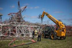 Crews devised a plan to use tow cables to lift the basket and debris off the victim for the extrication. Crews devised a plan to use tow cables to lift the basket and debris off the victim for the extrication.