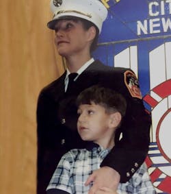 Marianne Monahan with her son Matthew Fiorito in her early days as an FDNY firefighter. Marianne Monahan with her son Matthew Fiorito in her early days as an FDNY firefighter.